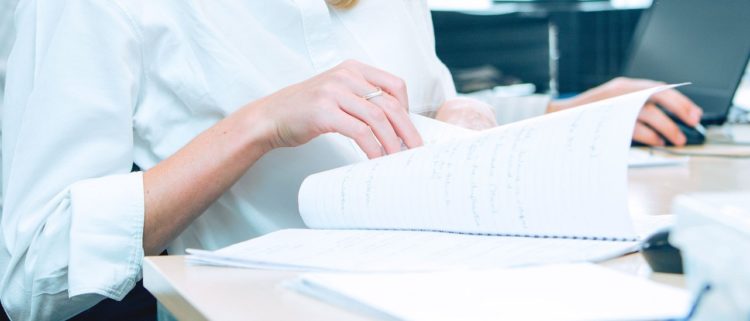 person looking at paperwork