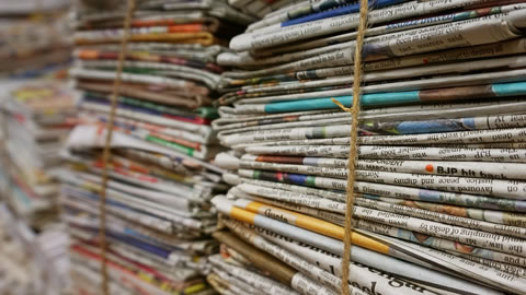 piles of newslpapers