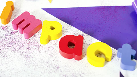 the word impact written in children's toys