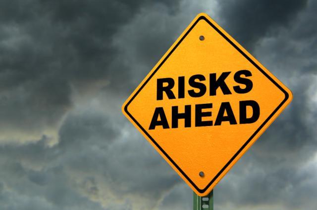 risks ahead road sign