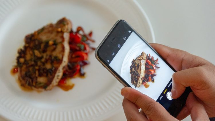 mobile phone taking a photo of food