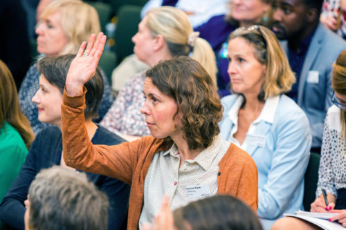 Person with their hand up