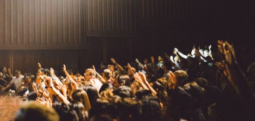People with their hands up