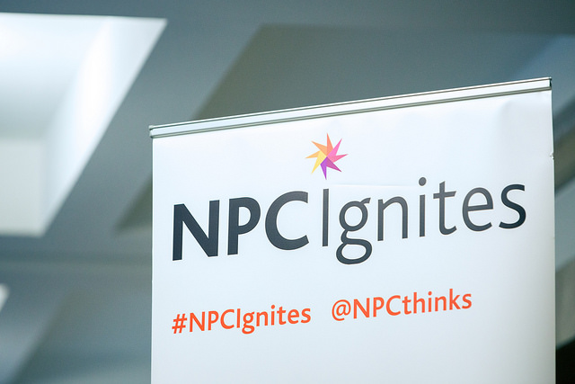 NPC Ignites logo and hashtag