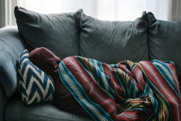A person couch-surfing.