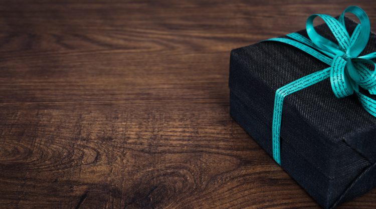 A close up of a gift box on a wooden table