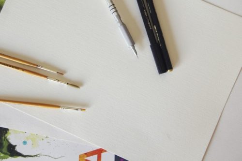 paper and paint brushes