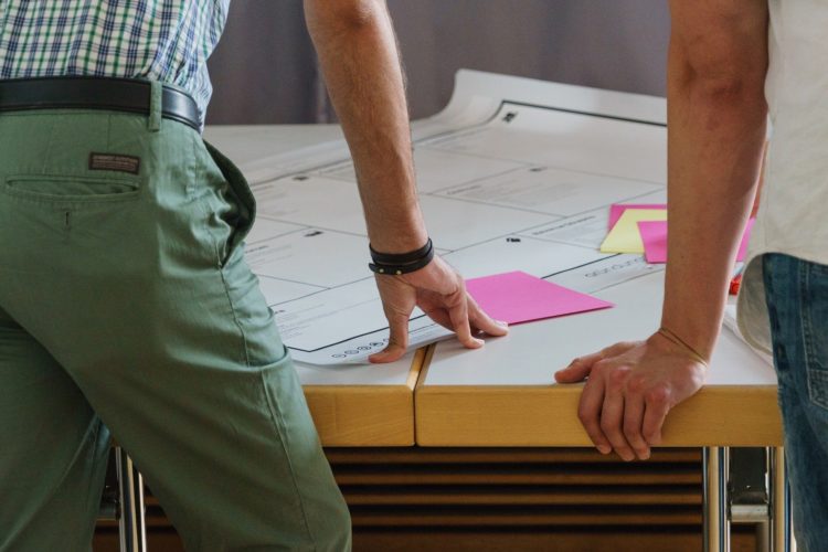 people consulting a plan