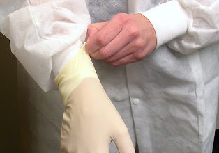 person wearing surgical gloves