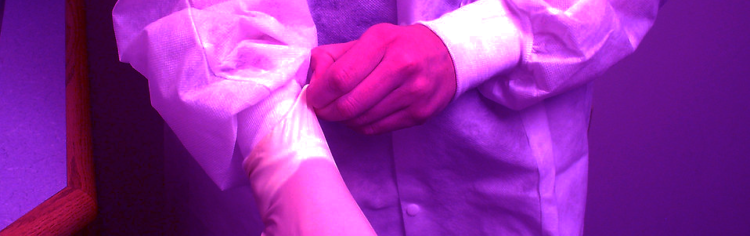 person wearing surgical gloves