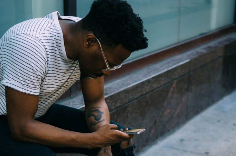 man looking on phone