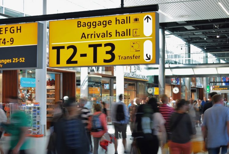Passengers arriving at airport arrivals