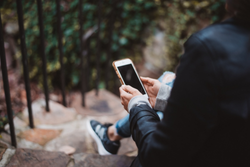 woman looking at smartphone