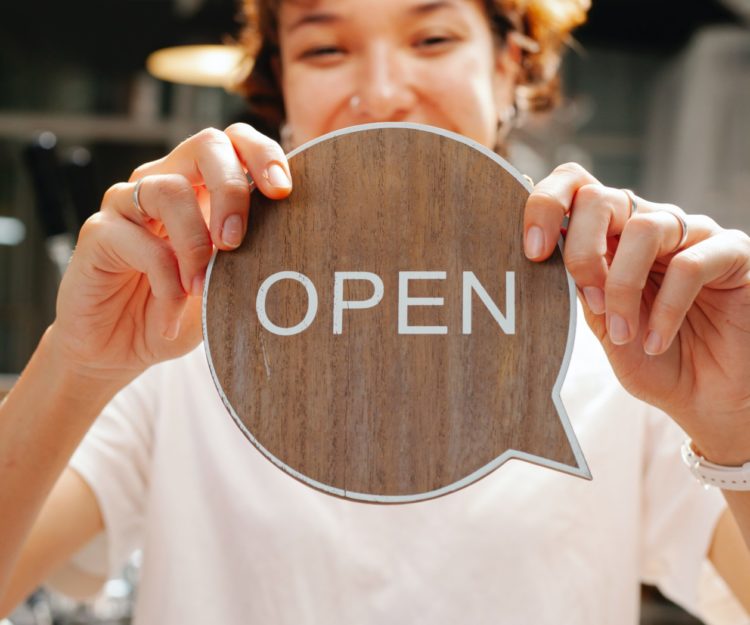 A sign that says open